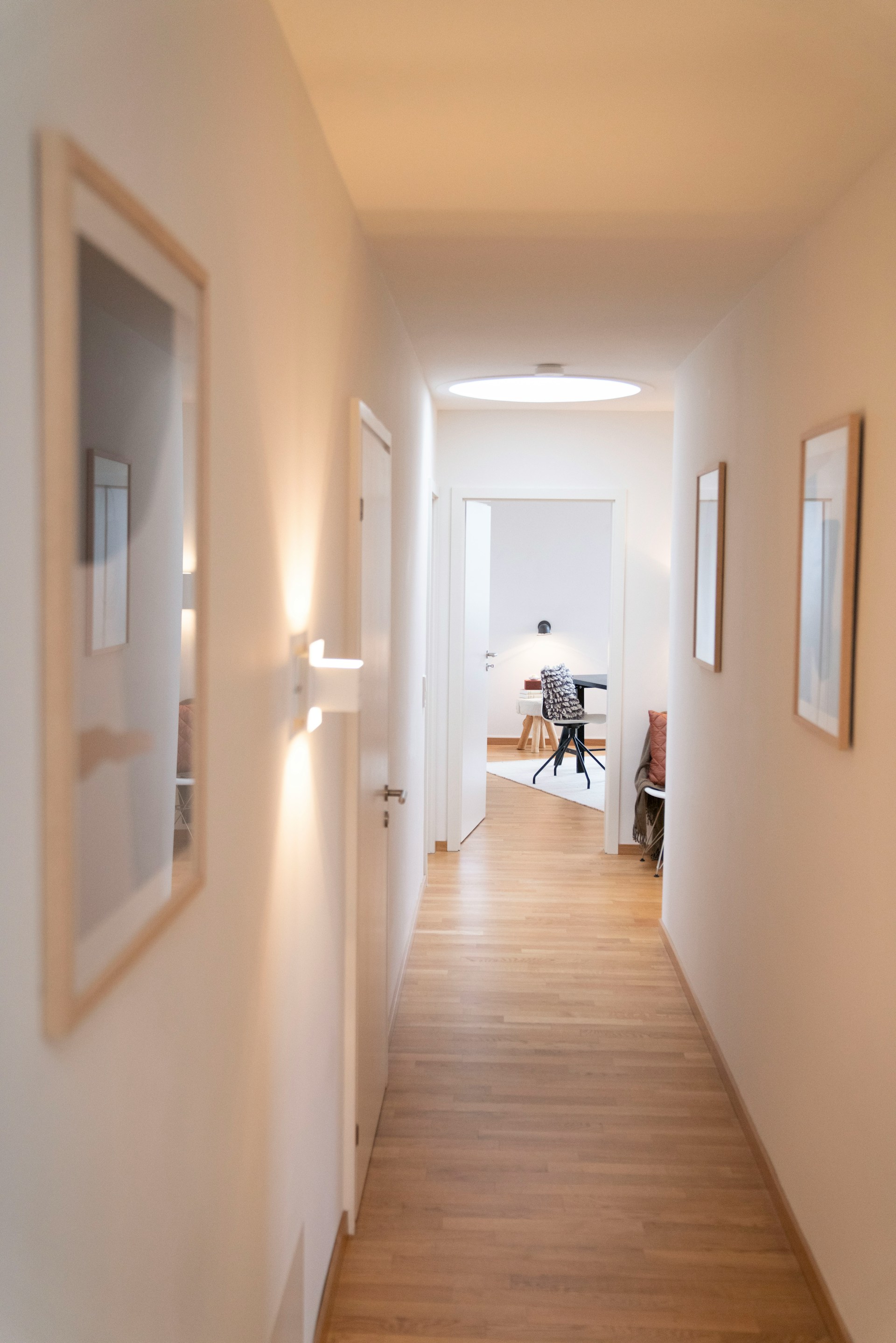 An empty hallway provides the perfect backdrop for a fresh start. Consider a stylish runner or vibrant rug to add warmth and personality to the space.