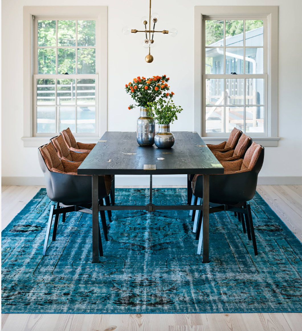 Timeless elegance beneath the table our turquoise Turkish Large vintage rug adds a touch of classic charm and cozy comfort.