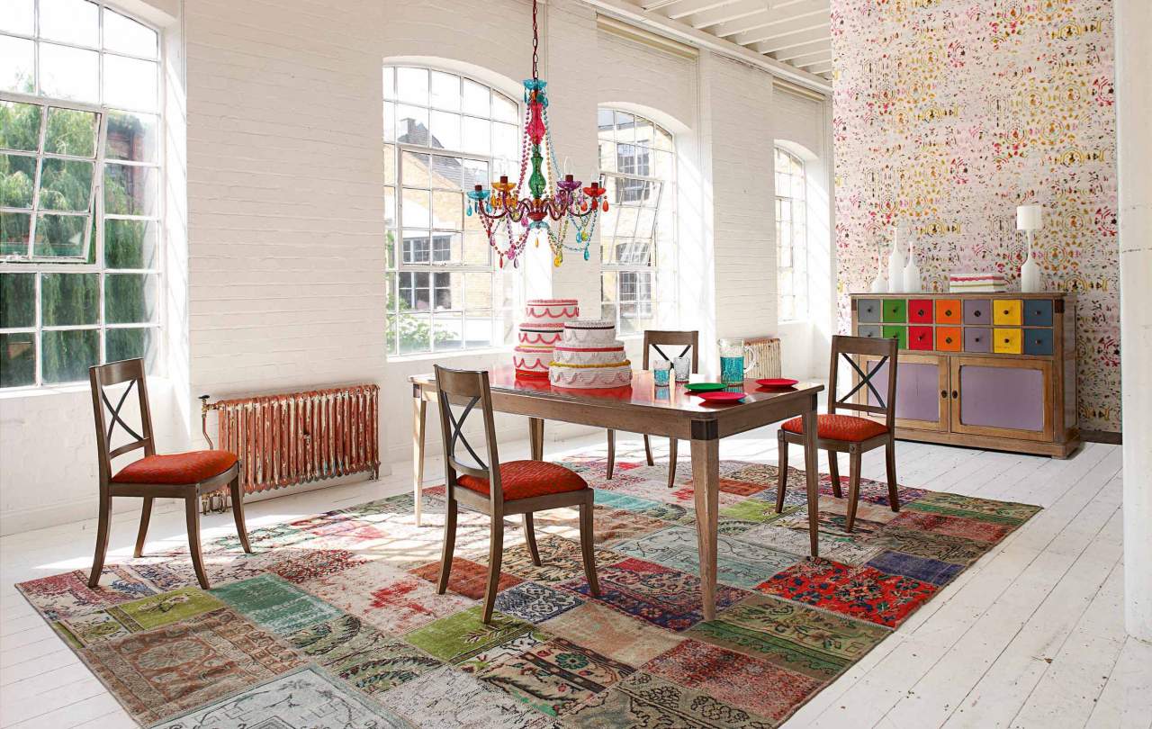 Handmade multicolor patchwork Turkish rug creates a vibrant foundation for our dining room gatherings