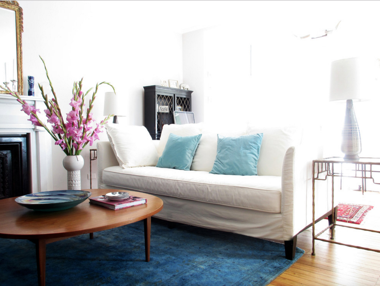 Vintage Serenity: Enhancing the Living Room with a Blue Turkish Carpet
