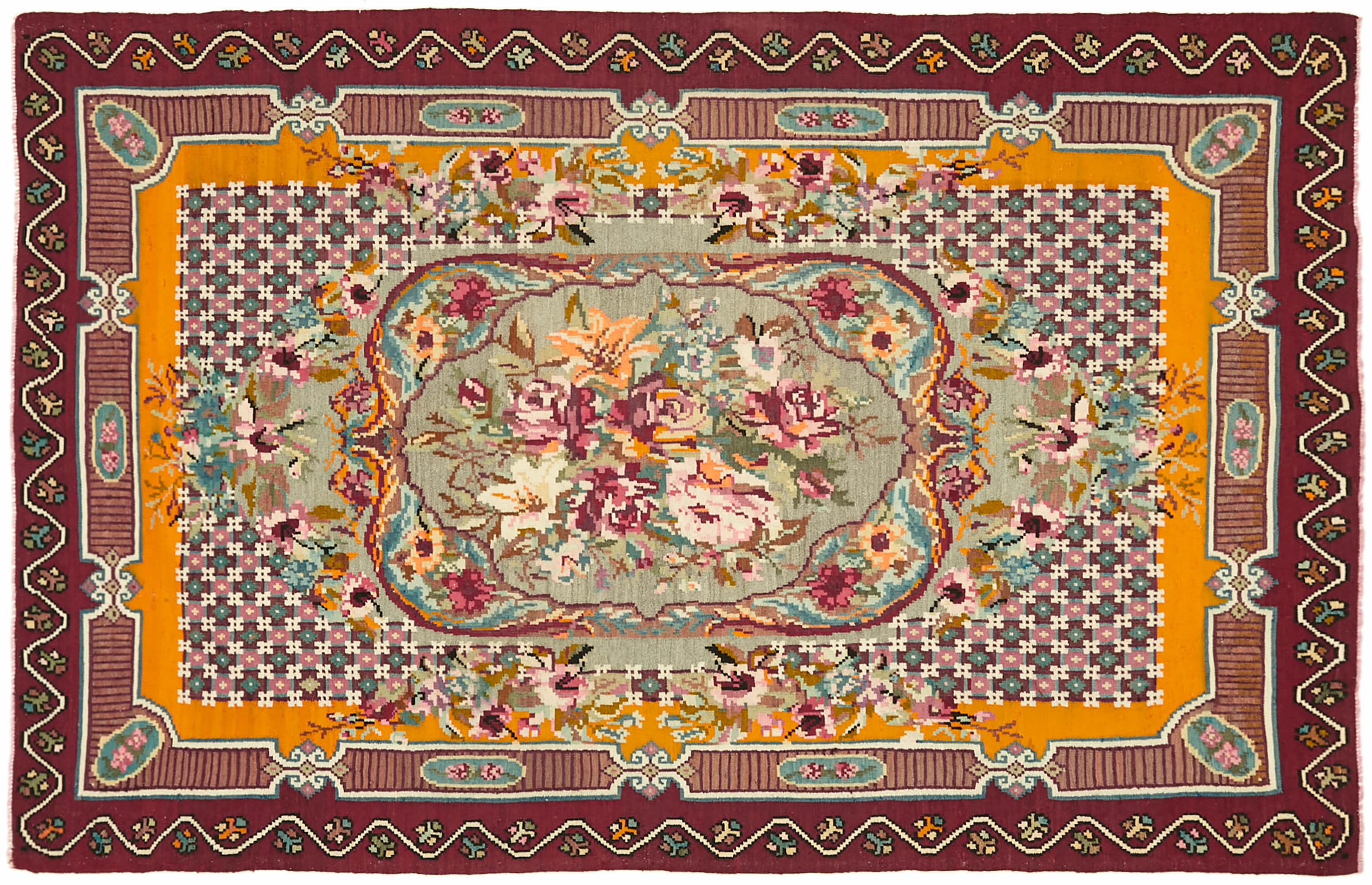 Rectangular, intricately designed flatweave floral kilim featuring a rich and vibrant color palette. The layout includes a central oval medallion with a floral motif, predominantly showcasing roses in shades of pink, red, and yellow, set against a light green background. The overall design is symmetrical and ornate, with a blend of traditional and floral patterns.