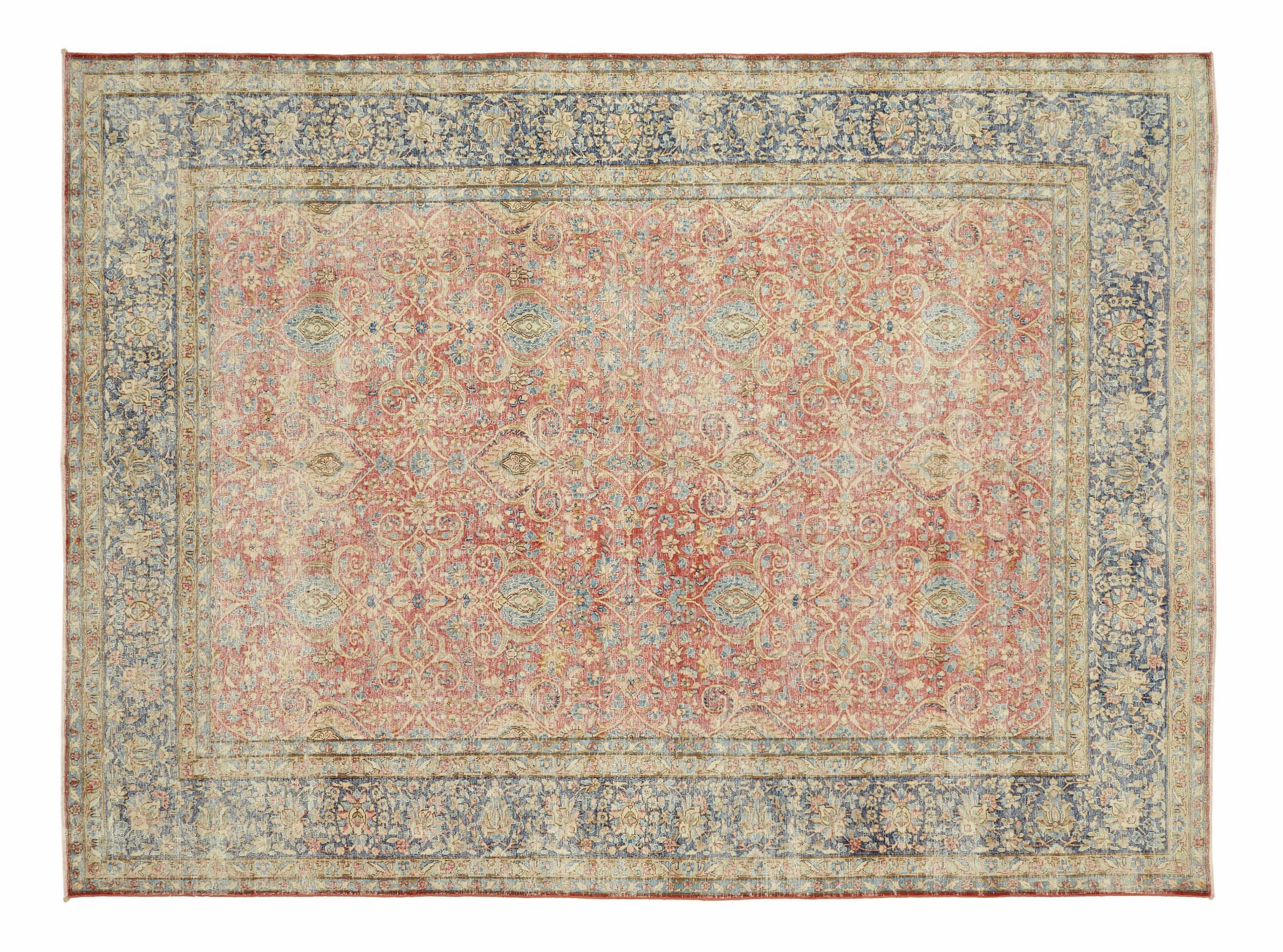 Turkish vintage rug with intricate floral and medallion patterns in faded red, beige, and blue tones – distressed handmade Anatolian carpet perfect for bohemian and traditional interior decor