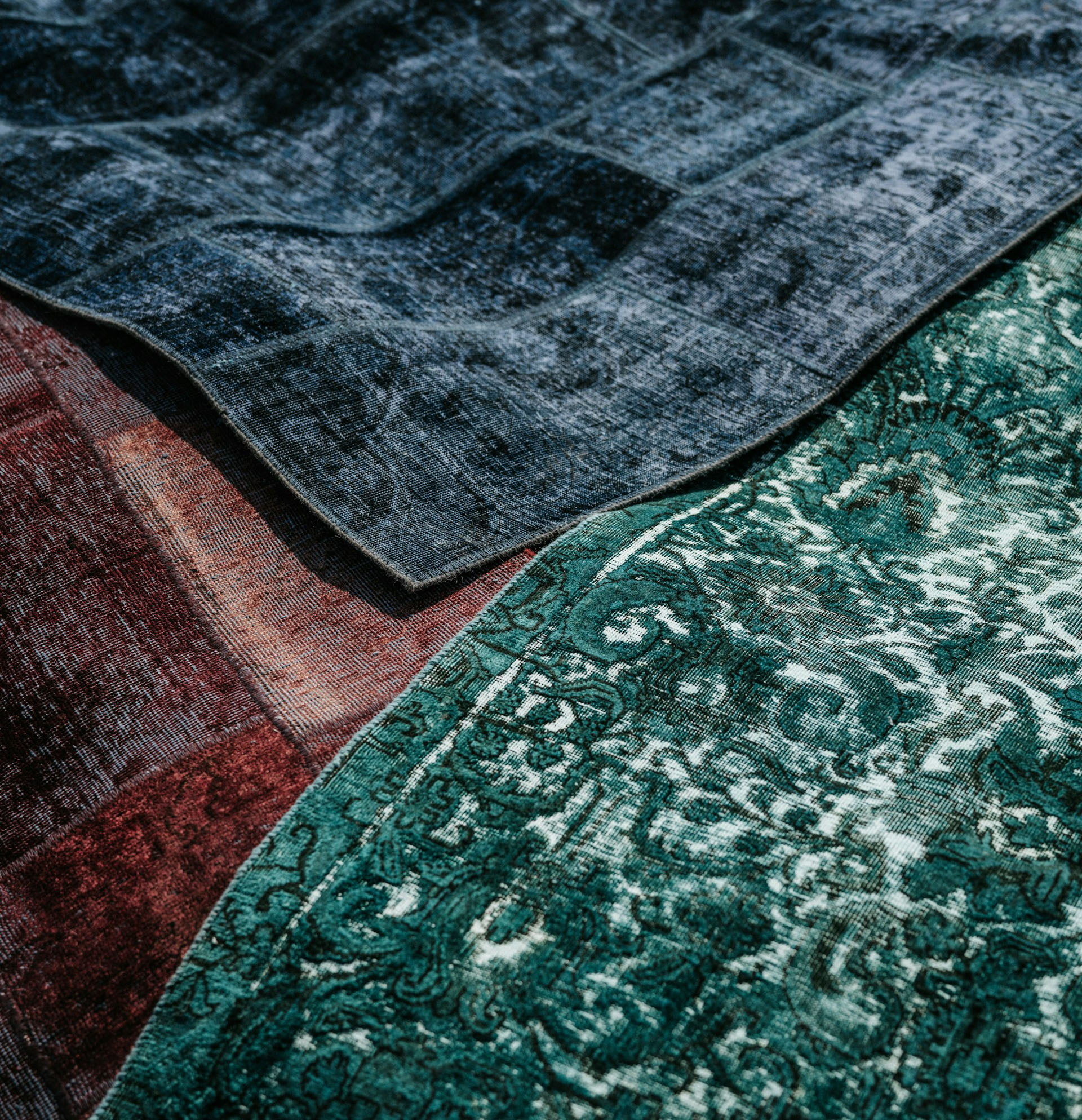 Detail view of a hand-knotted Turkish rug, highlighting the craftsmanship and the unique color variations of the wool threads