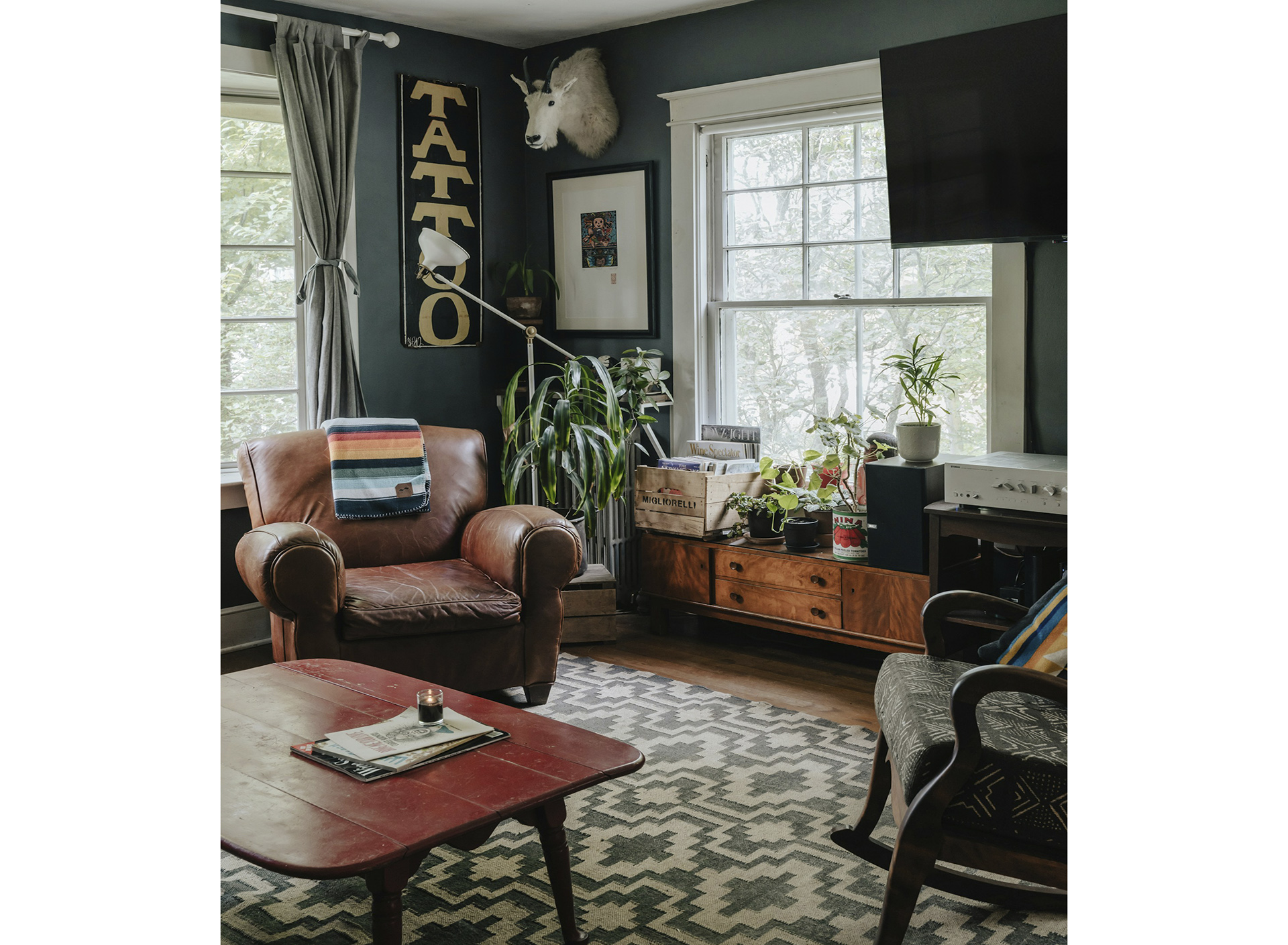 An inviting contemporary interior featuring a richly textured handwoven rug with subtle patterns, harmoniously blending with a light-filled space and comfortable, modern furnishings.