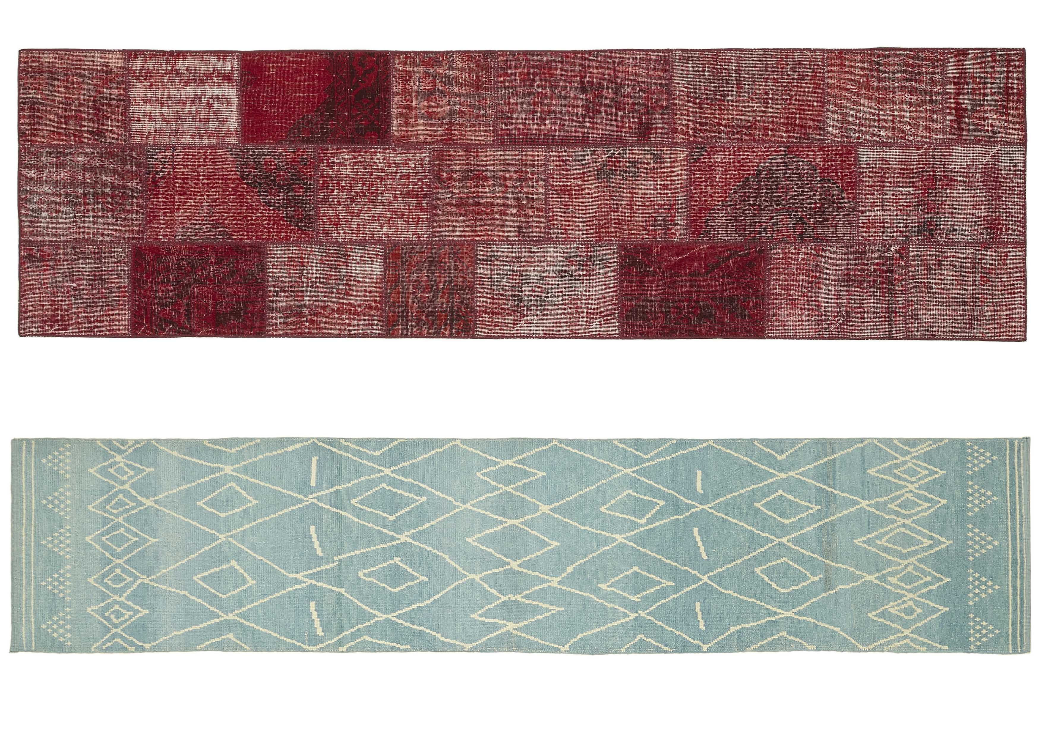 Two rectangular rugs placed side by side. The top rug is a patchwork style with a rich, deep red colour palette that incorporates various shades and patterns creating a textured look. The design features a mix of geometric and abstract shapes, giving it a vintage and eclectic look. The underlying rug is a light blue Moroccan carpet runner with a symmetrical diamond pattern in white, providing a more modern and minimalist aesthetic. The contrast between vibrant red and soft blue creates a striking visual balance. Both rugs are placed on a plain white background, highlighting their different styles and colours.