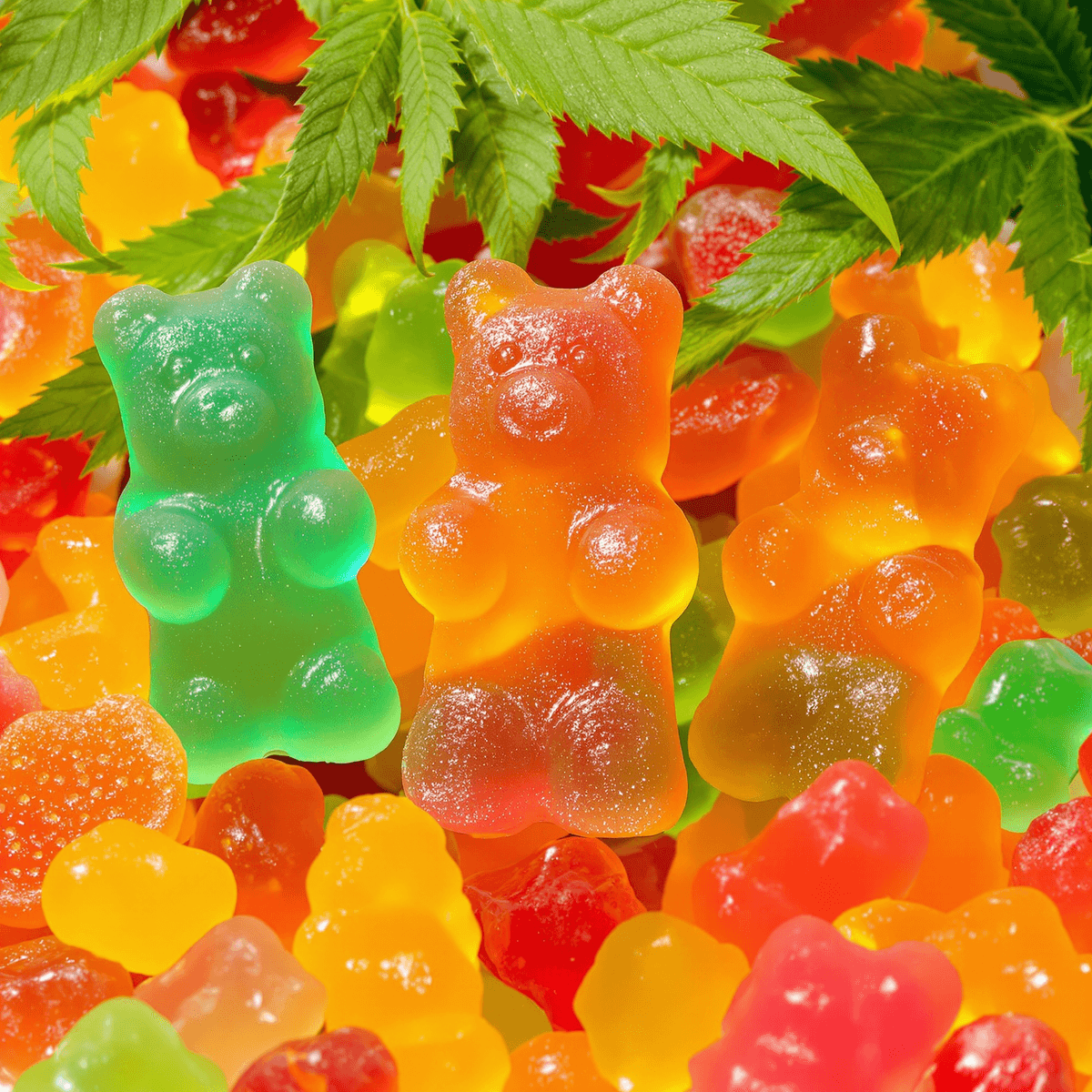 A close-up of colorful gummy candies shaped like bears and fruit, set against a backdrop of hemp leaves, creating a fun and inviting atmosphere.