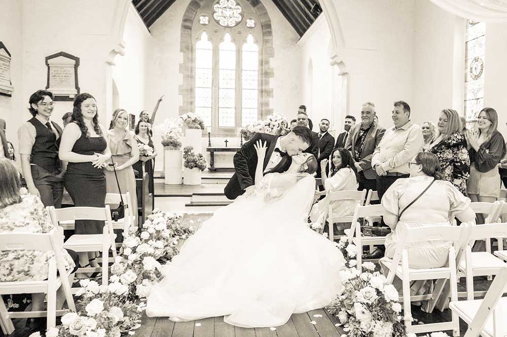 Bride and Groom kissing in the Chapel at Lord's Estate for their Sydney Wedding