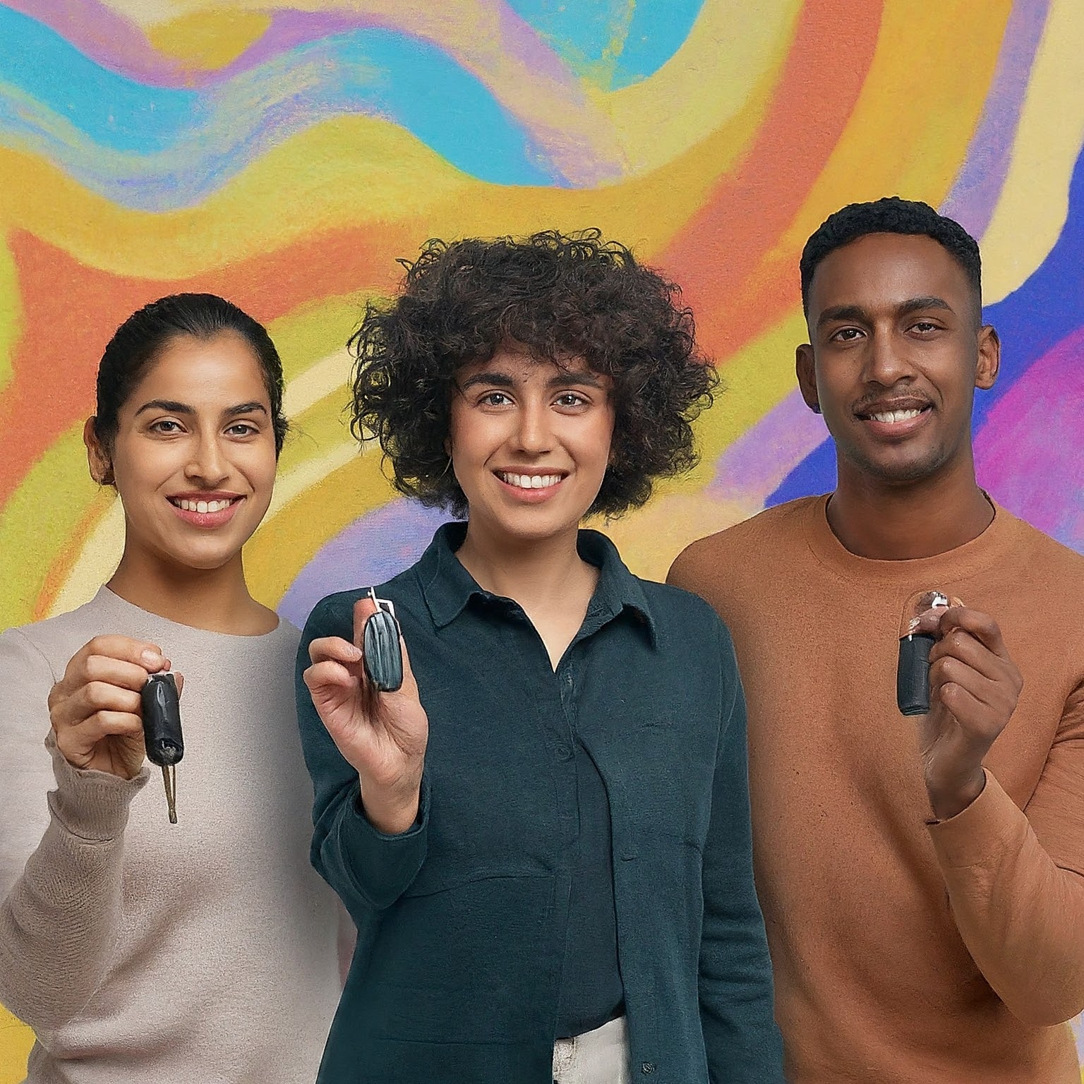Three people holding cell phones in their hands.