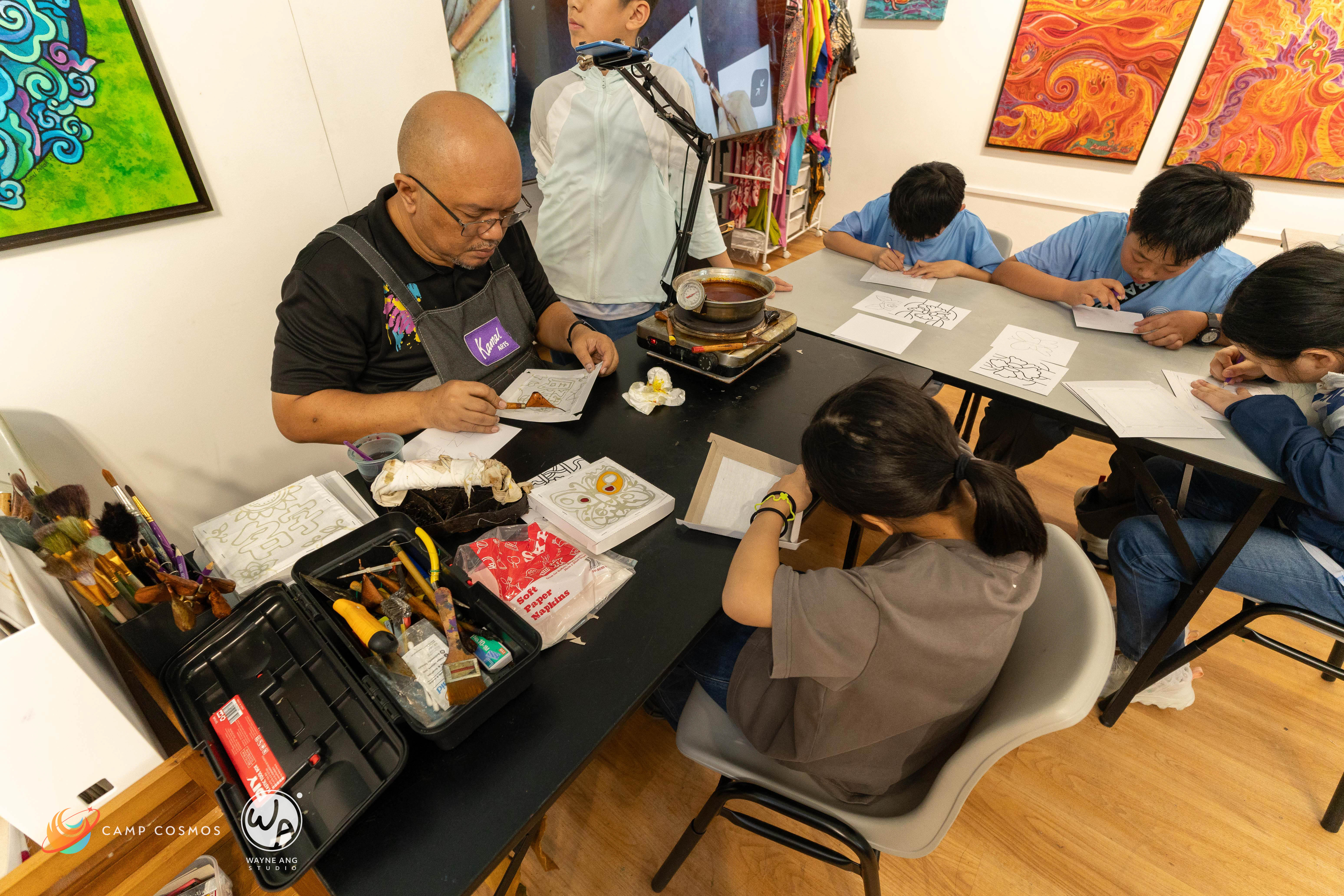 Students learn and experience local cultural arts in Malay Batik Painting with the master himself.