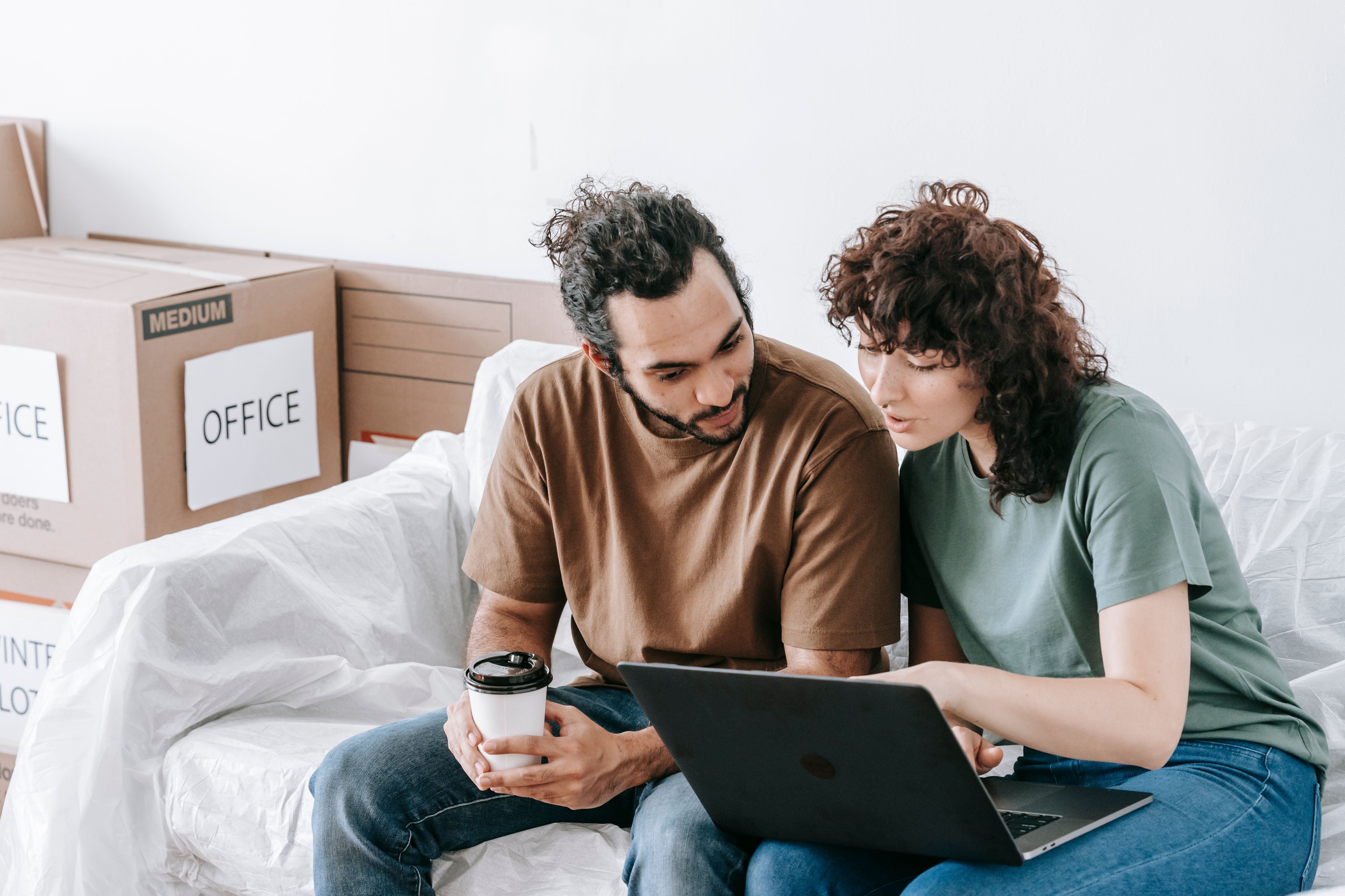 Couple planning a move while updating their resume address for relocation
