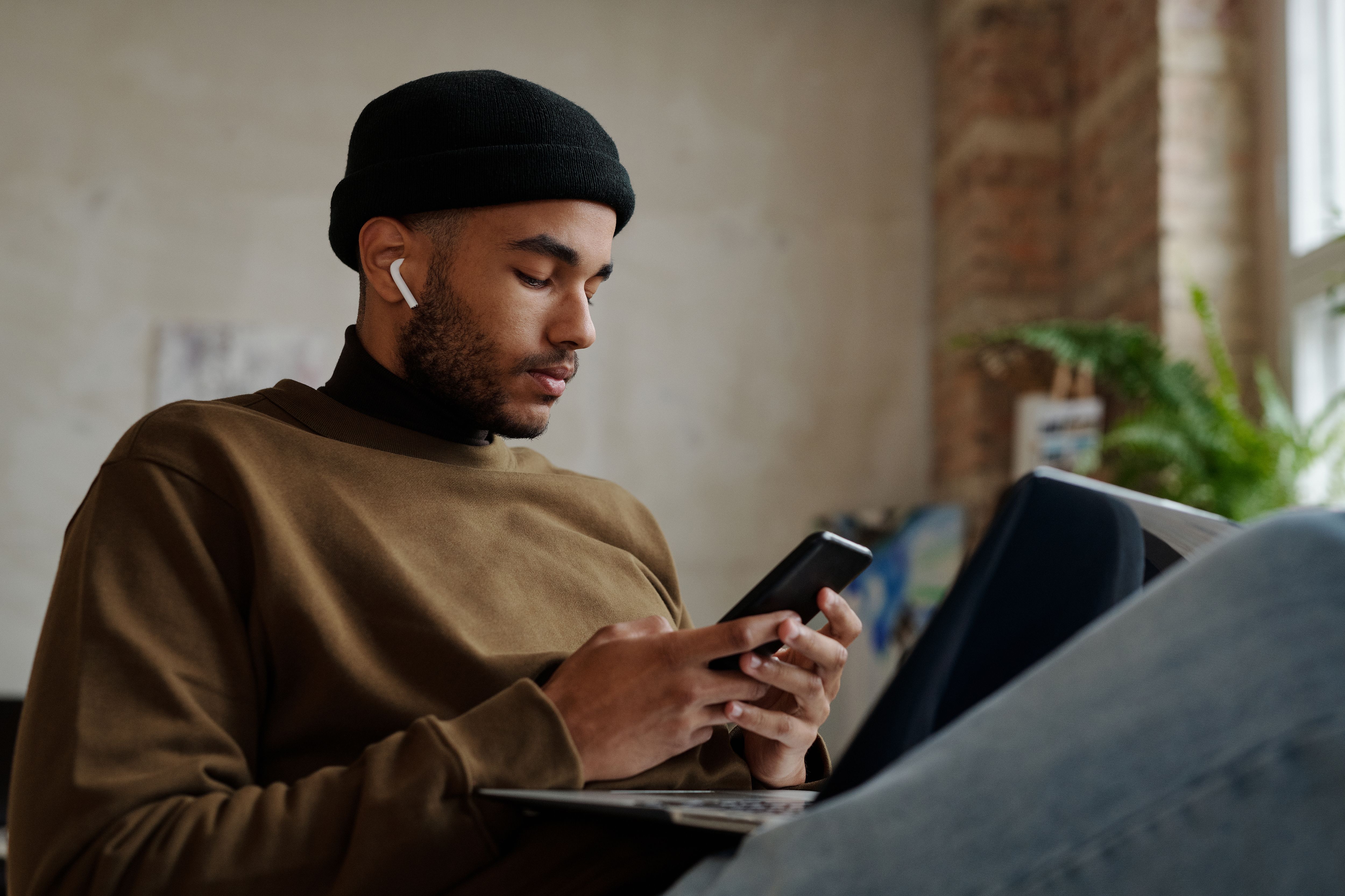 Young adult using a laptop to manage healthcare and personal admin tasks