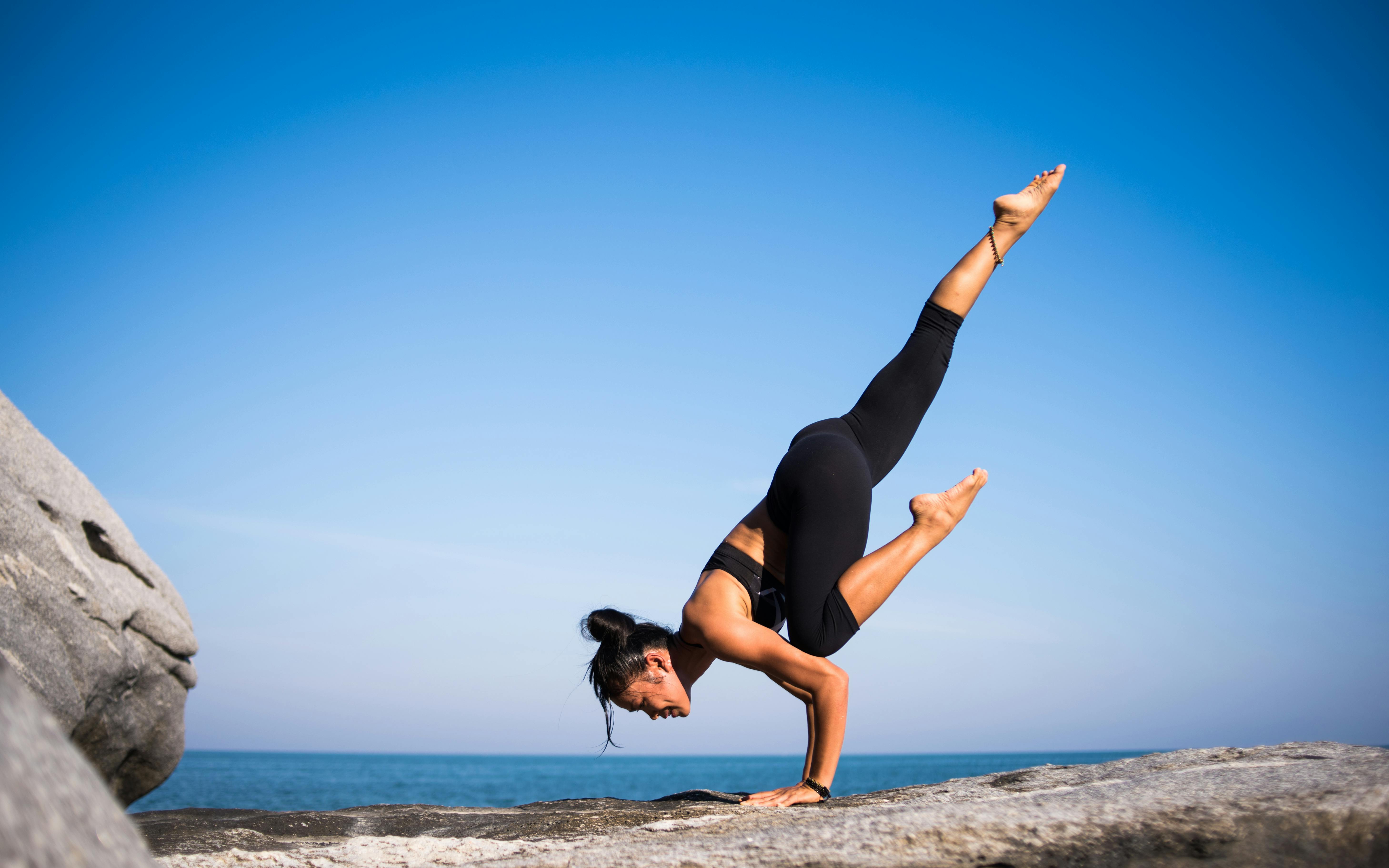 a woman doing yoga with a great balance